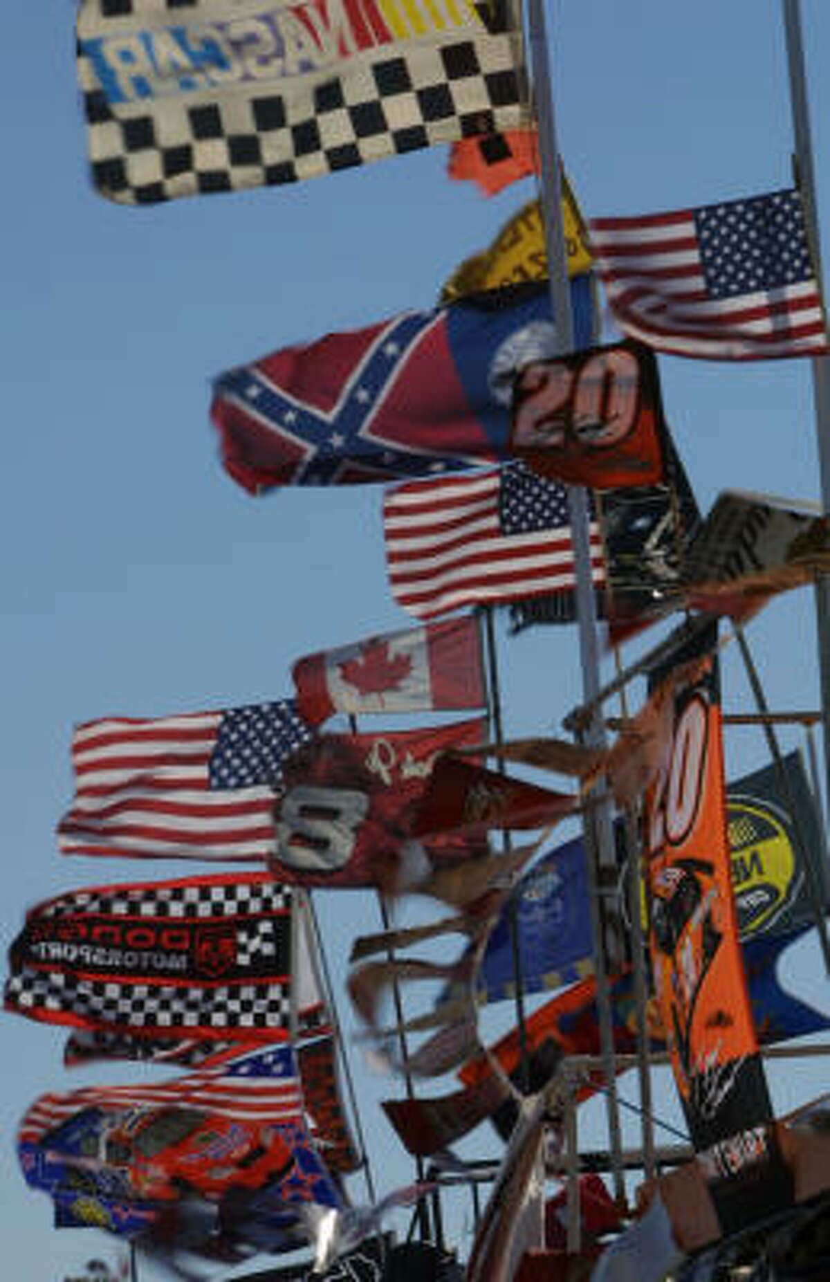 Auto Racing fans flags fly at Daytona International Speedway in Daytona Beach, Fla., before Sunday's Daytona 500.