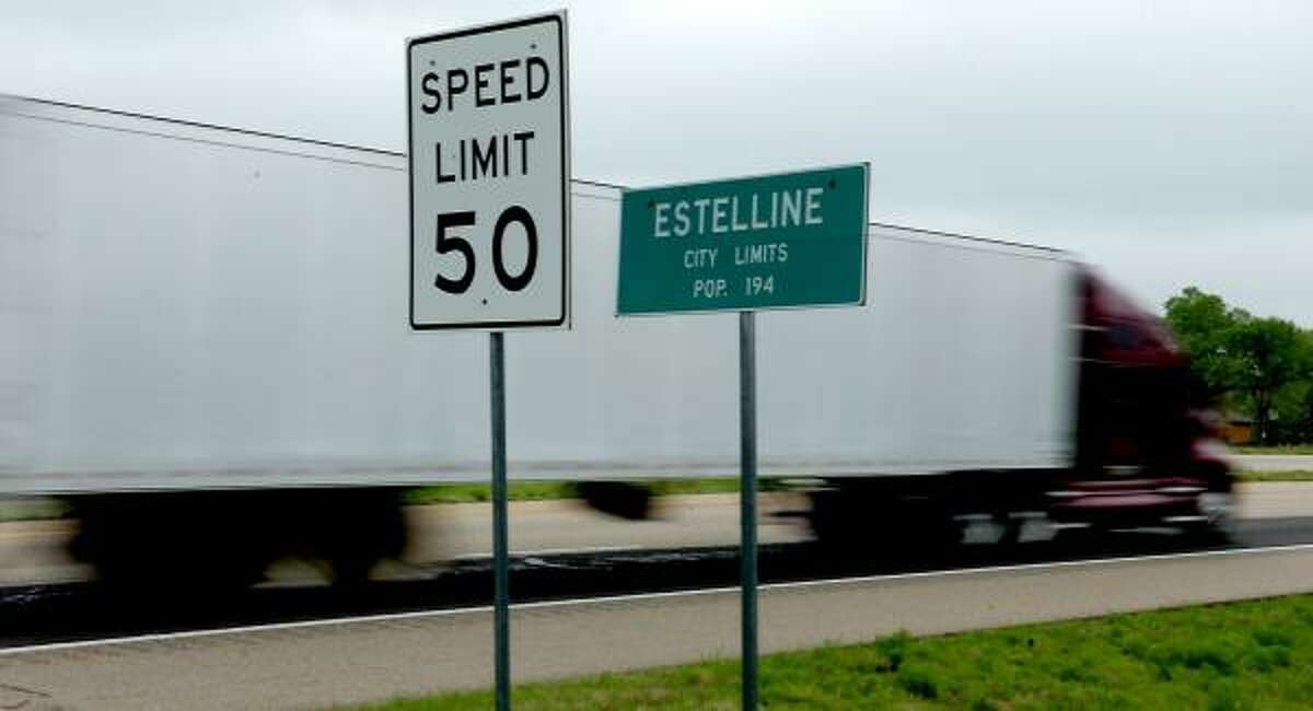 A truck enters the tiny Panhandle town of Estelline on U.S. 287. Many motorists get caught zooming through the town's one yellow light. Estelline counts on the revenue from these speeding tickets to bolster their city budget.