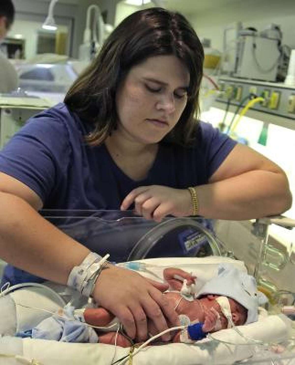 Karoline Byler looks at her newborn son Jackson.