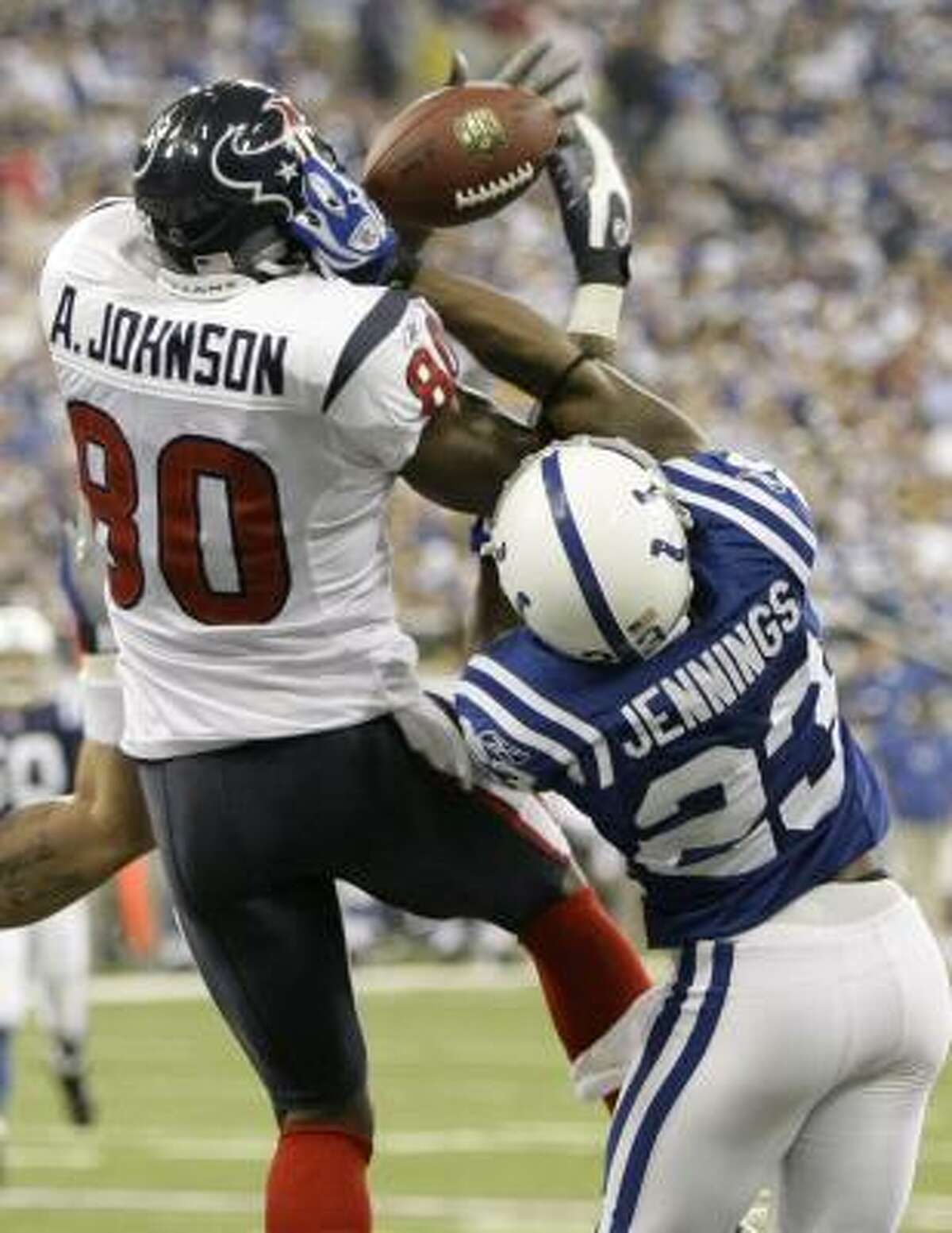 Andre Johnson, who had seven catches for 74 yards, can't haul in a long pass from Sage Rosenfels as Indianapolis' Tim Jennings (23) defends in the fourth quarter.