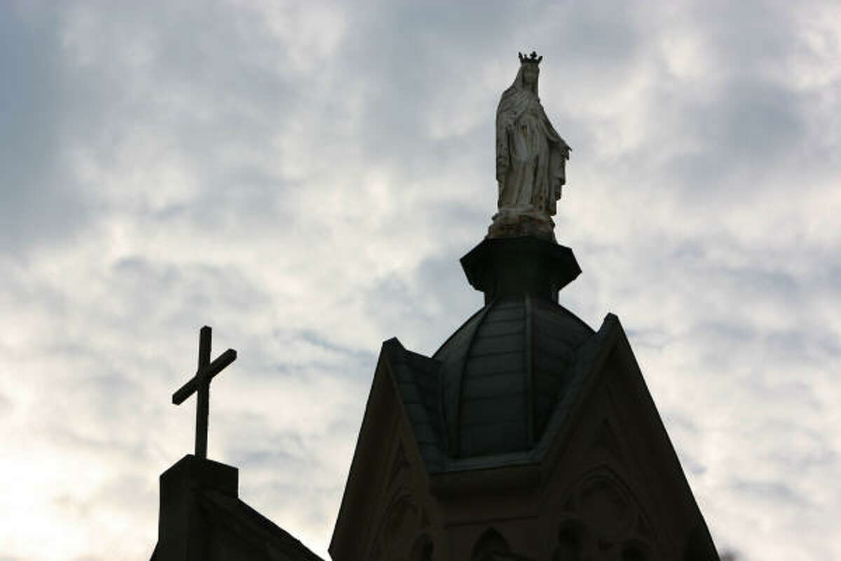 Statue of patron saint stands tall over St. Mary's Cathedral on Sept. 18. Despite flooding, the Cathedral survived Hurricane Ike.