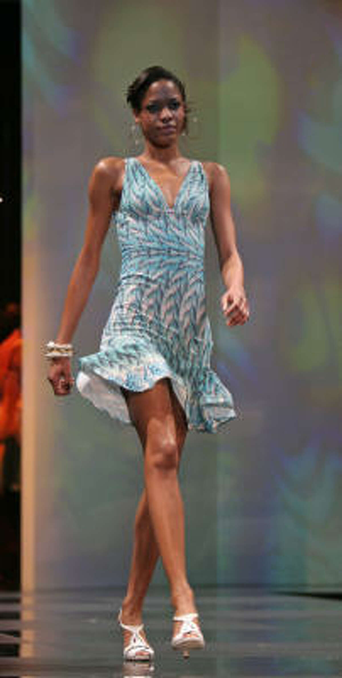 Jean-Paul Gaultier's ruffled wrap dress in jersey exudes feminine grace.