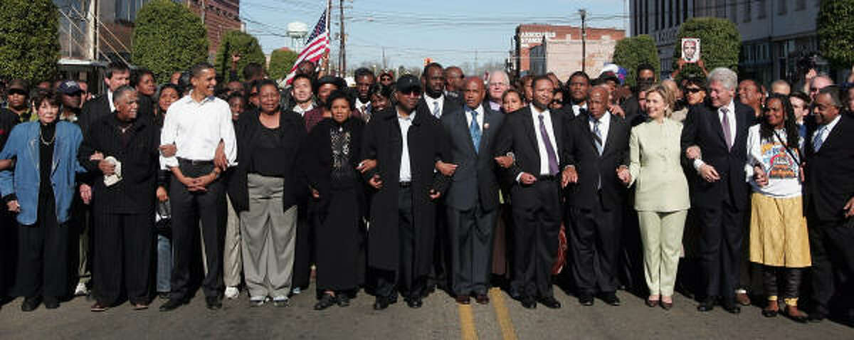 Sen. Barack Obama, in white shirt at left, and Sen. Hillary Rodham Clinton with former President Clinton, at right, march in Selma, Ala.