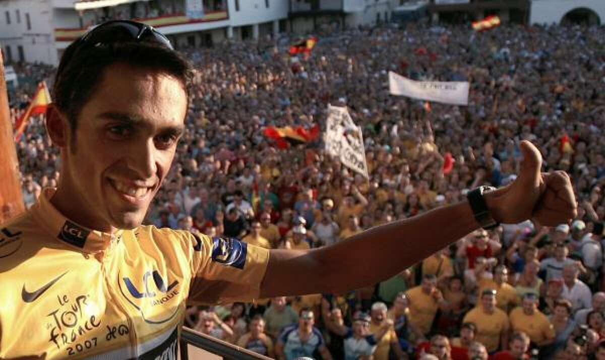 Spain's Alberto Contador appears in front of hundreds of well-wishers in his home village of Pinto near Madrid.