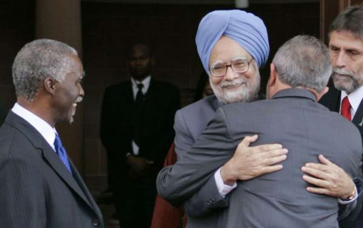 Indian Prime Minister Manmohan Singh, center, greets Brazil's president, Luiz Inacio Lula da Silva, on Wednesday in Pretoria, South Africa. Thabo Mbeki, president of South Africa,is on the left.