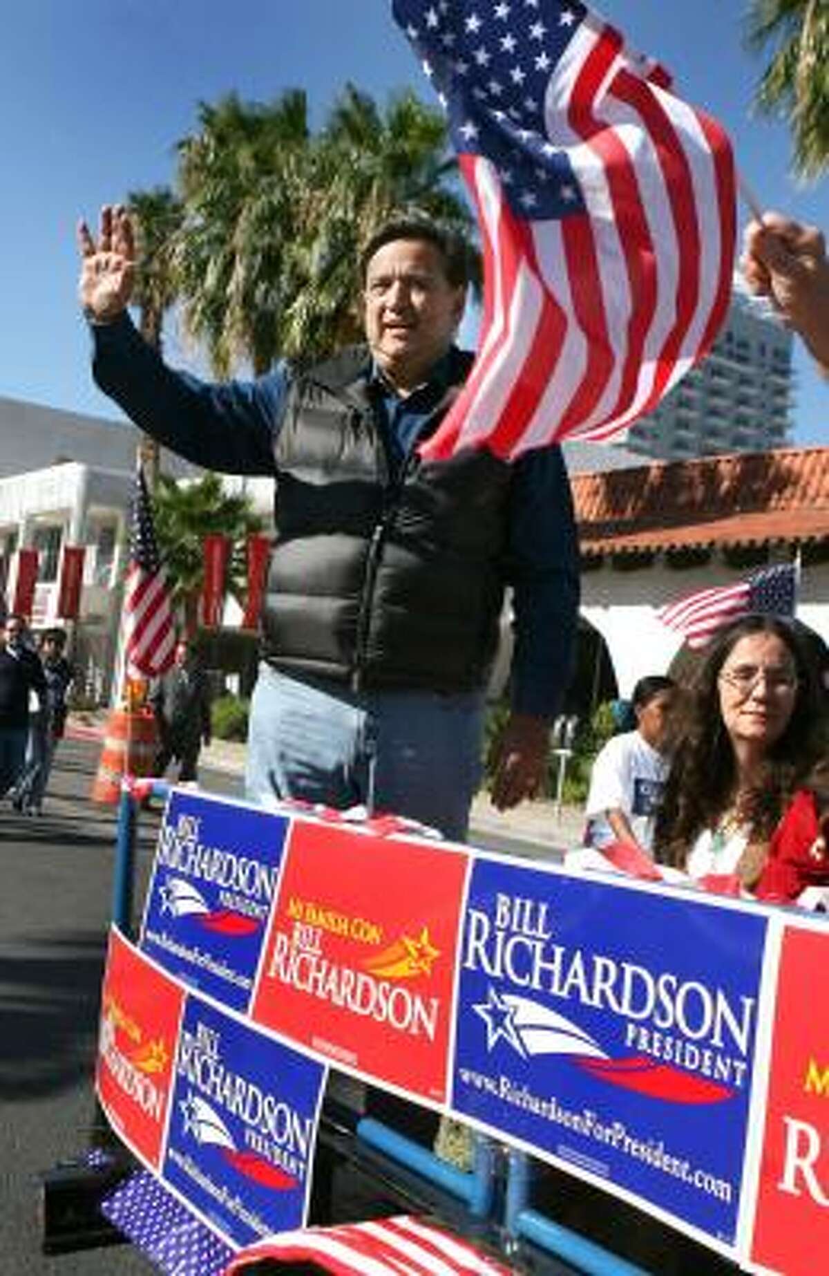 Democratic presidential hopeful New Mexico Gov. Bill Richardson rides in the Hispanic International Day Parade in Las Vegas on Oct. 13. Richardson's Anglo name presents a challenge with Hispanic voters, but, an analyst says, that could be overcome with aggressive outreach in person, on television and in Spanish-language media. Richardson has a Mexican mother and an Anglo father.
