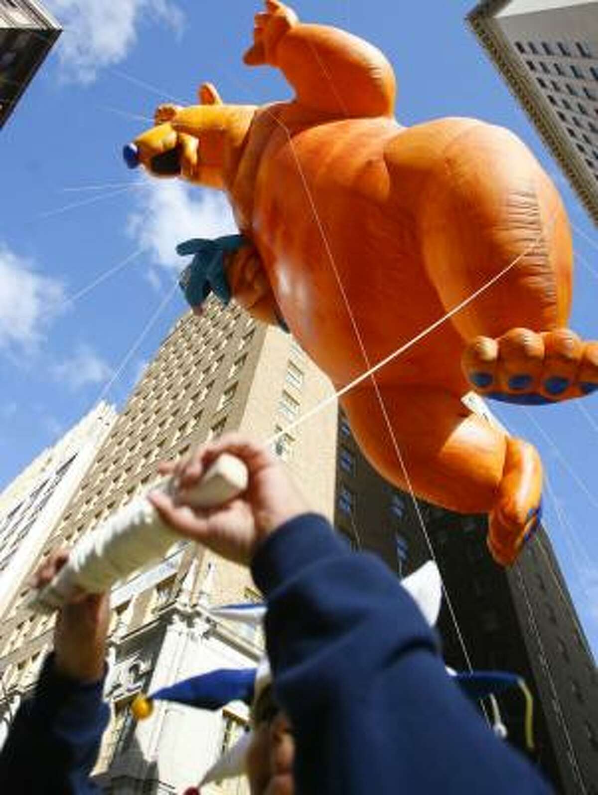 Marcus Wade, 10, of Houston helped hold down a giant bear balloon in last year's H-E-B Holiday Parade.