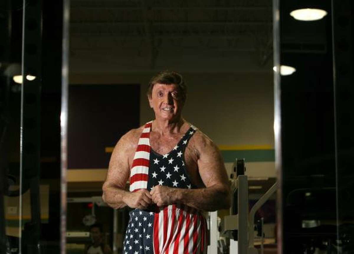 Paul Bernstein, 74, looks at himself in a mirror between sets as he trains at a 24-Hour Fitness recently. For Bernstein, age is a state of mind.