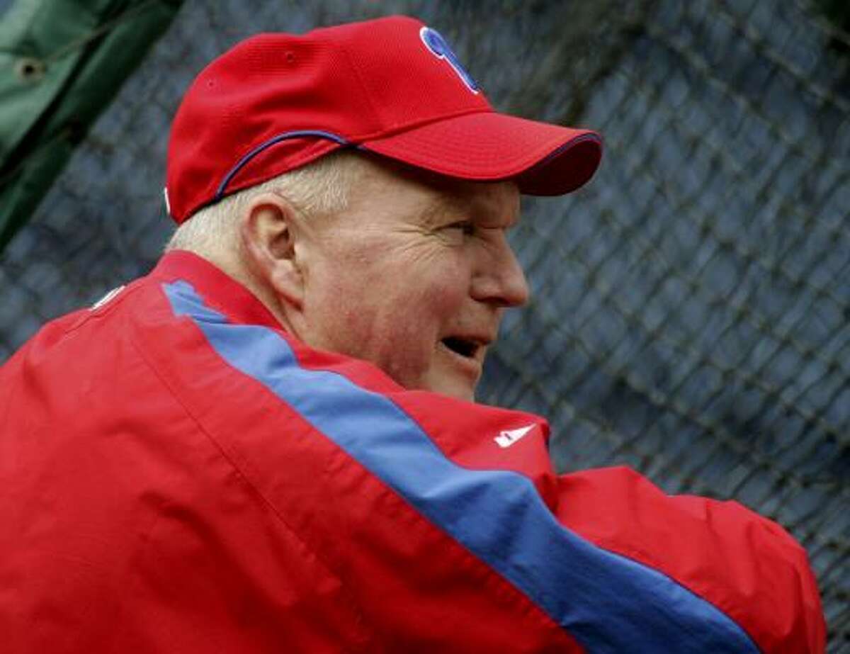 Philadelphia Phillies manager Charlie Manuel watches his team during workouts Tuesday in preparation for their divisional series playoff series with the Colorado Rockies.