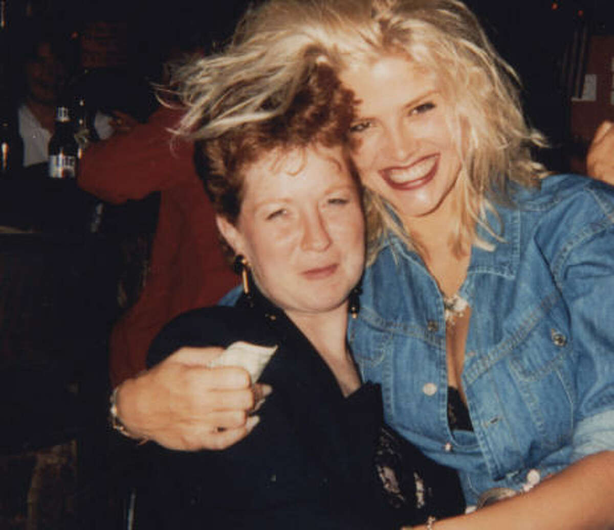 Vickie Lynn Hogan sits on Sandi Powlege's lap during their "first date" at The Hill, a bar on Kuykendahl, in Houston, in 1991.