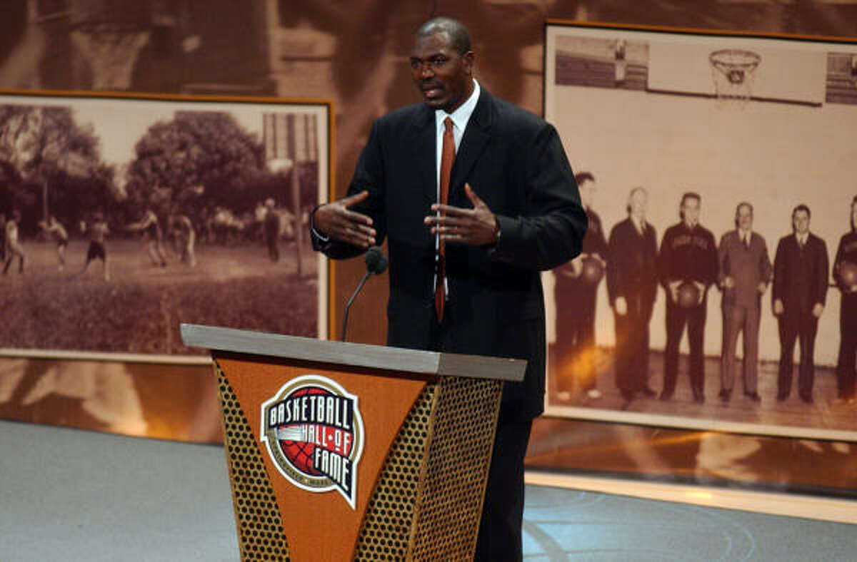 Former Rockets center Hakeem Olajuwon delivers his induction speech during Friday's ceremony at the Basketball Hall of Fame in Springfield, Mass.