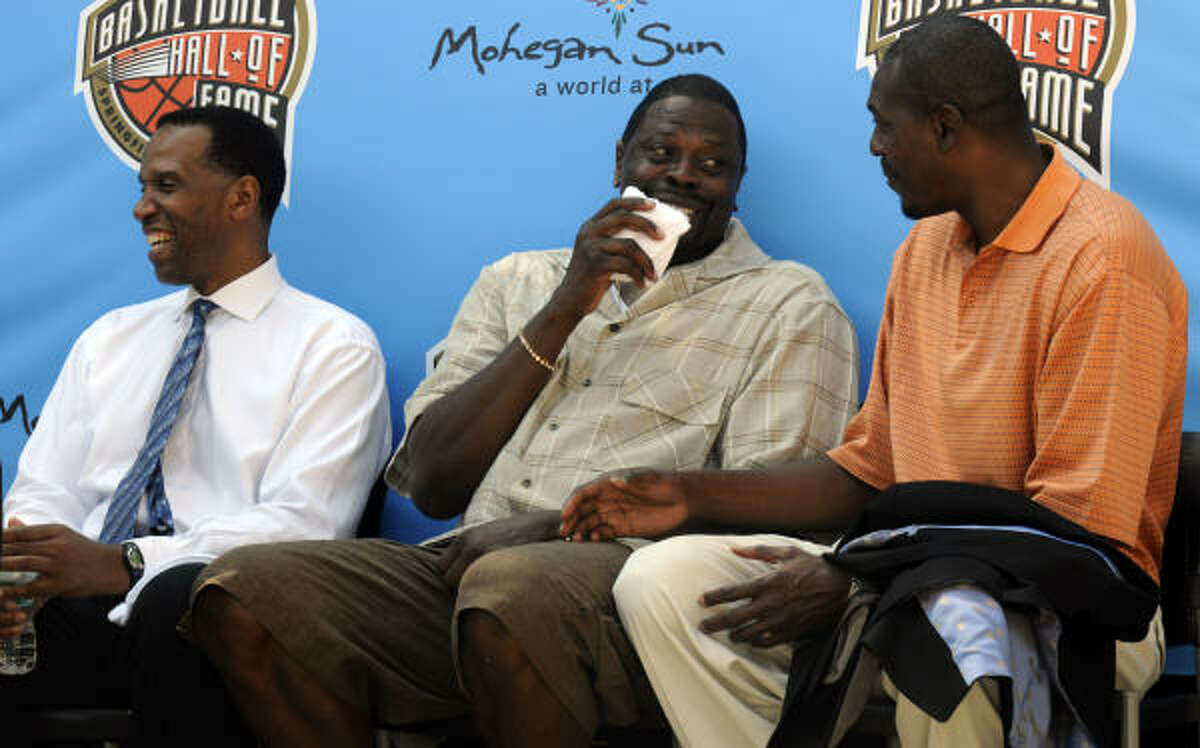 (From left) Former NBA players Adrian Dantley, Patrick Ewing and Hakeem Olajuwon share a laugh at Friday's news conference.