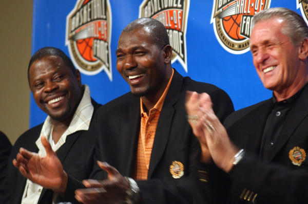 (From left) Former NBA players Patrick Ewing and Hakeem Olajuwon and coach Pat Riley share a light moment during a news conference at the Basketball Hall of Fame.