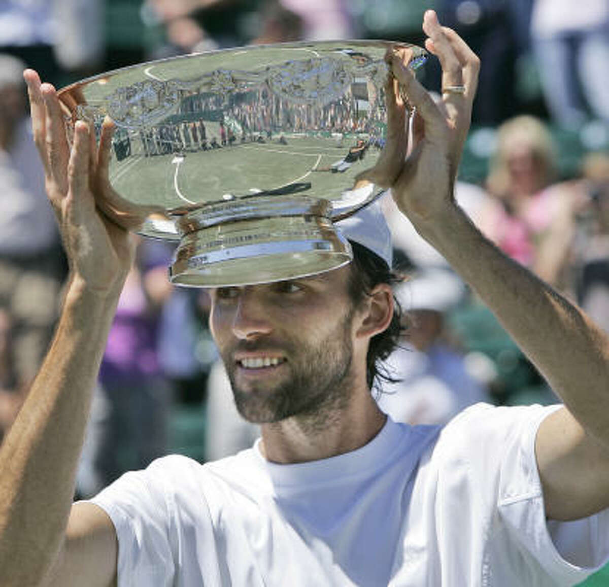 Ivo Karlovic held the champion's trophy for the first time in his career on Sunday. He recoreded 10 aces in the final match, giving him 53 for the week.