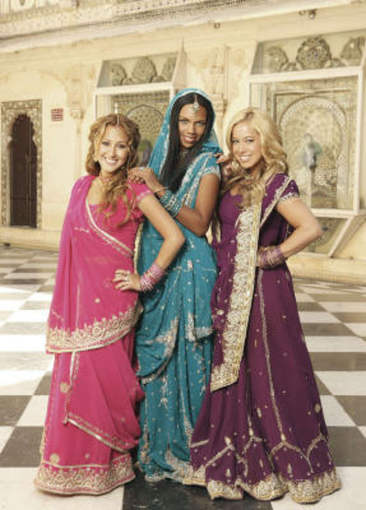 Adrienne Bailon as "Chanel," from left, Kiely Williams as "Aqua" and Sabrina Bryan as "Dorinda" star in The Cheetah Girls One World airing on the Disney Channel.