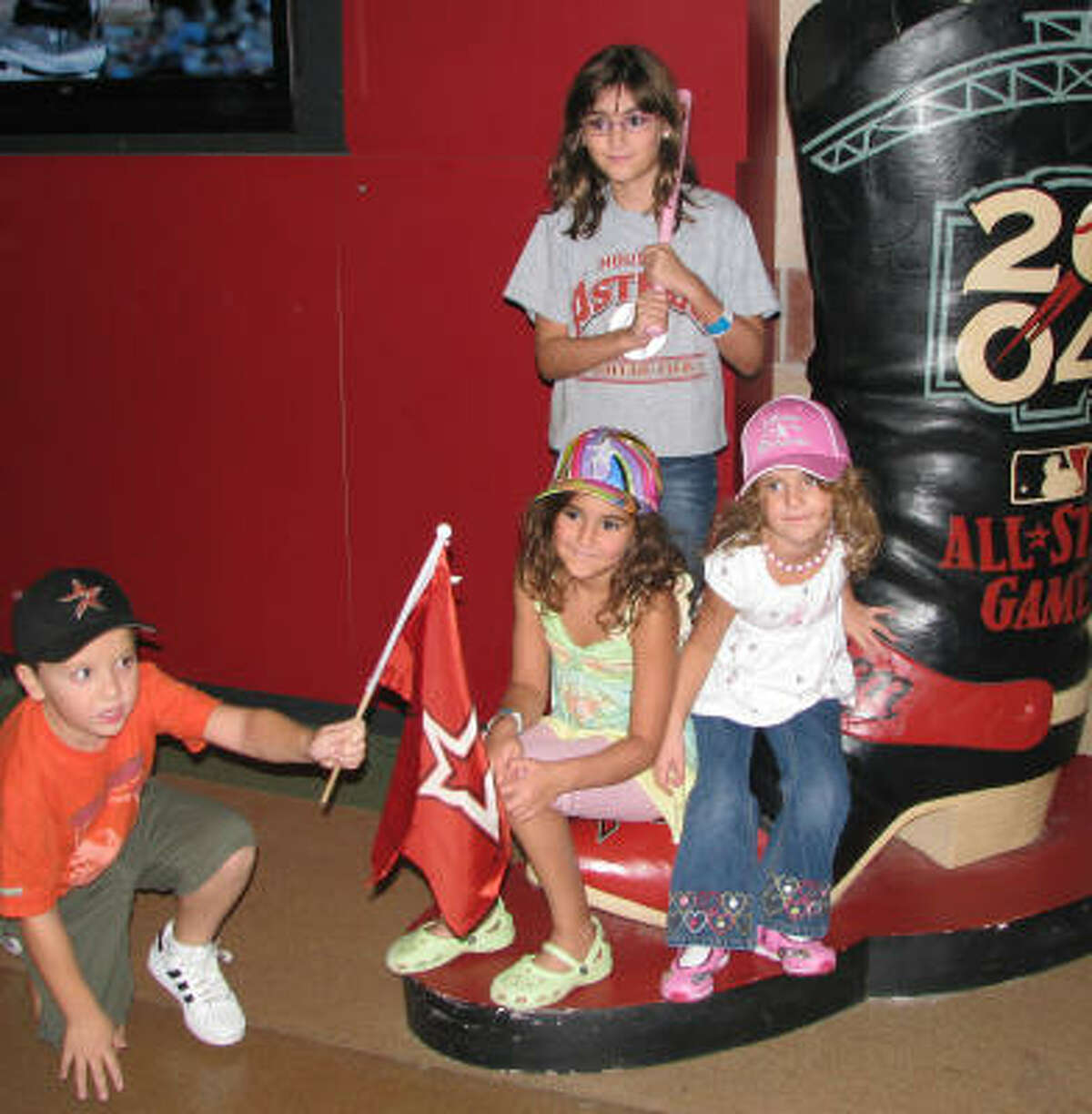 Game 2, Diamondbacks versus Astros, August 16, 2008: (From left) Jake Kolker, Sidney Daniels, Allison Daniels and Janey Daniels have taken a liking to this big boot.