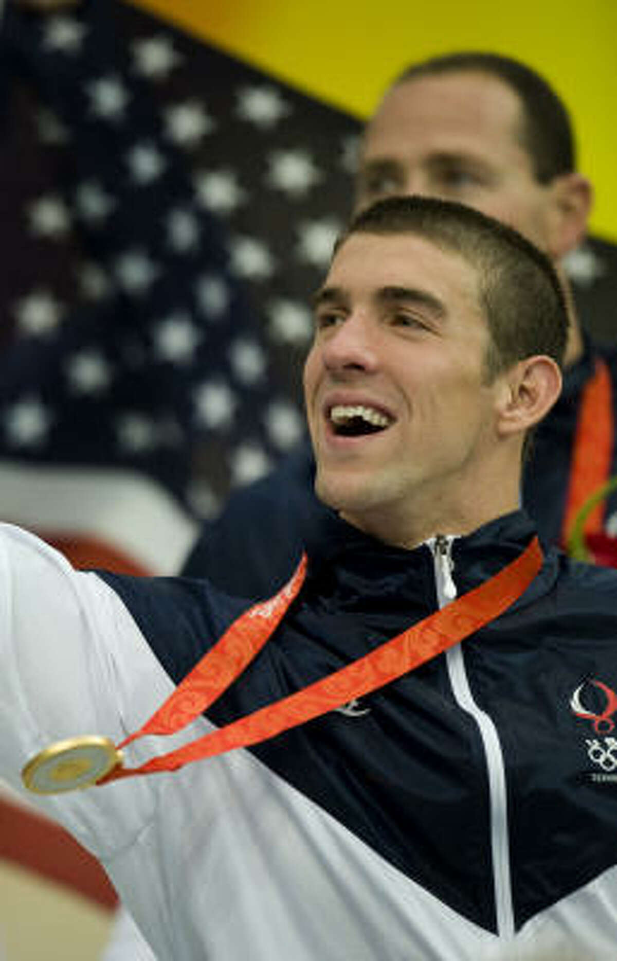 August 17: Michael Phelps celebrates his record 8th gold medal in Beijing after the U.S. won the men's 4X100m medley relay.