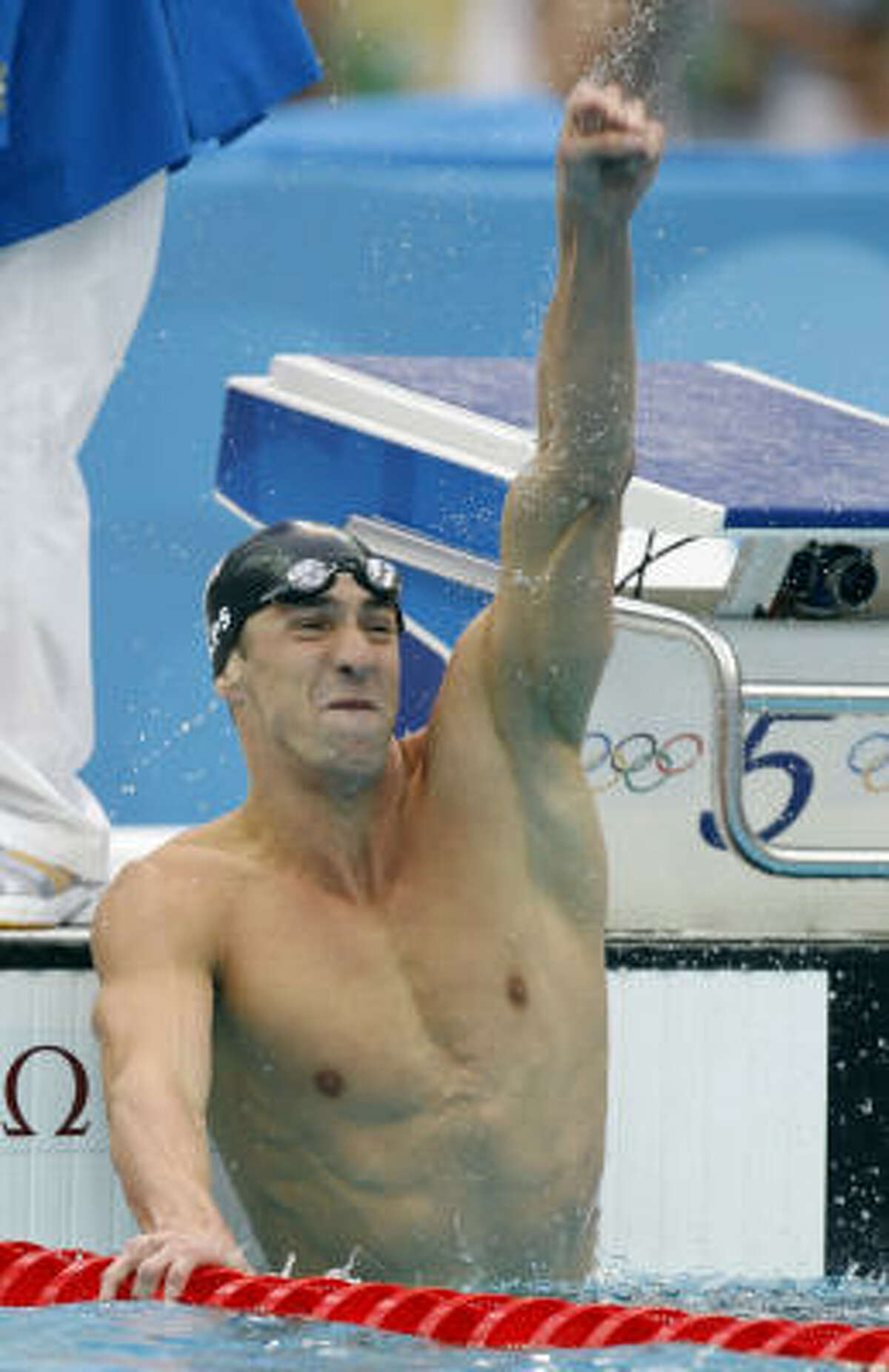 Aug. 16: Michael Phelps reacts after winning the men's 100 Butterfly, claiming his record-tying seventh gold medal in Beijing.