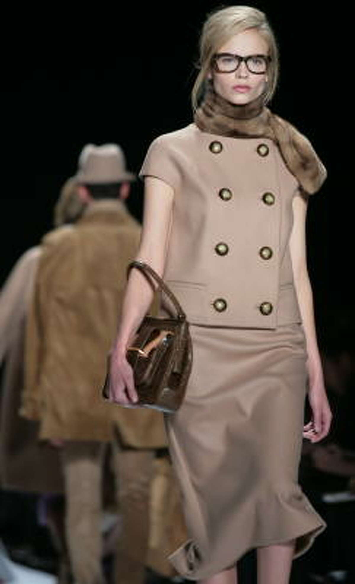 The Michael Kors 2008 fall collection paid homage to the Mad Men look of the early 1960s with a two-piece suit and boxy jacket.