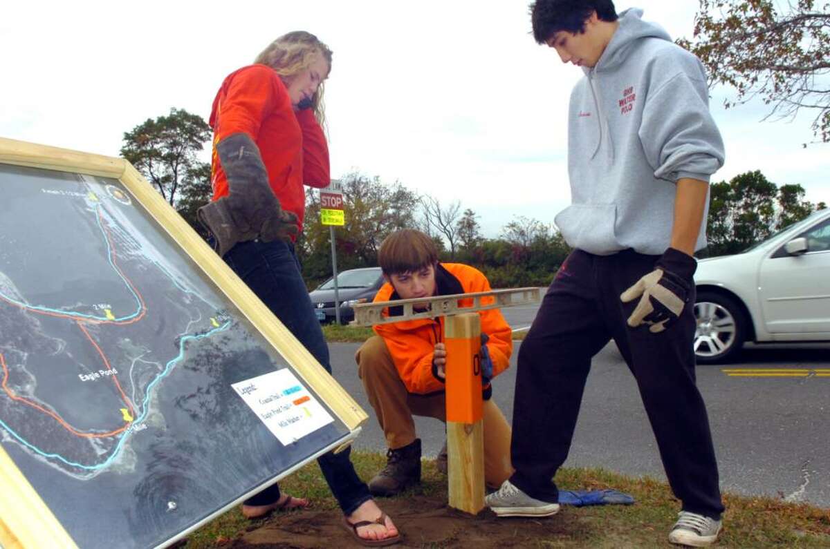 Greenwich Point, Oct. 12, 2009. Hans Christian Thalheim, 17, center, is marking out the Eagle Pond trail to earn his Eagle Scout statis. Friends Yvonne Vogt, 18, and Eagle Scout Tom Sorenson, 17, helps.