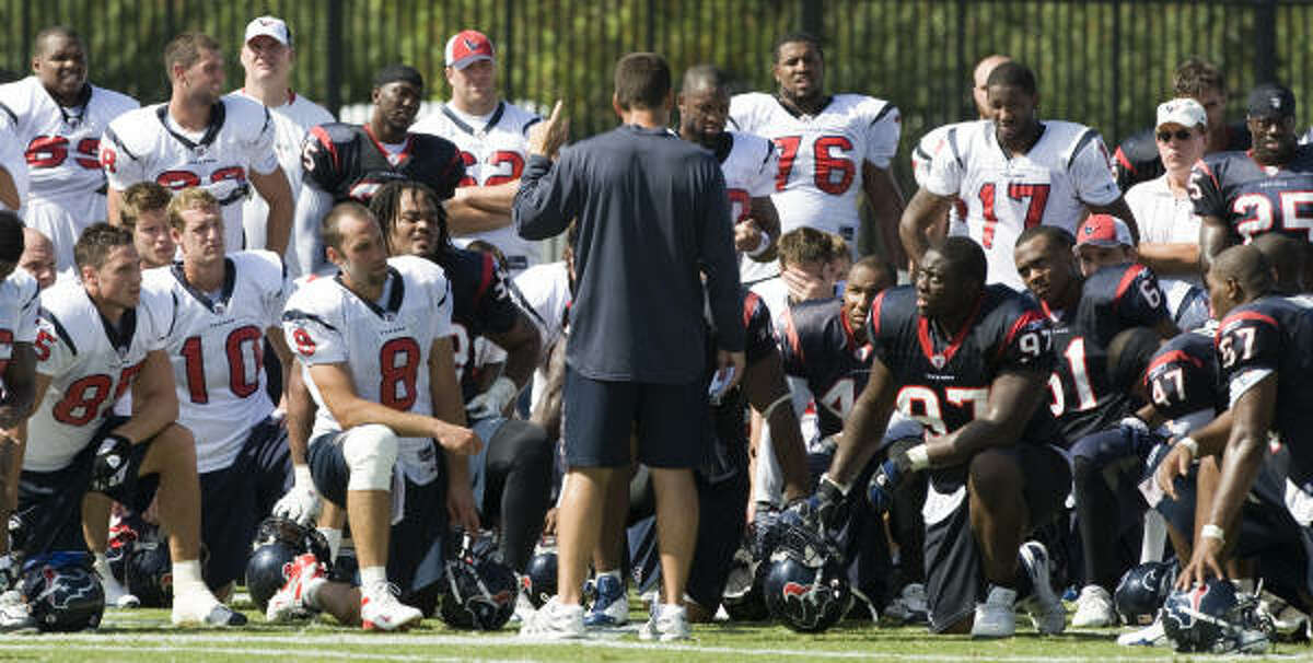 July 28: Texans head coach Gary Kubiak talks to his players at the end of morning practice.
