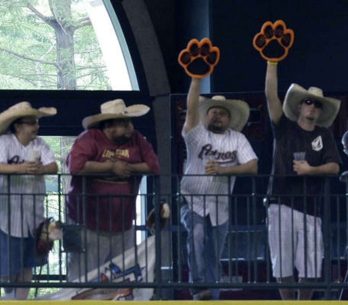 Game 3, Pirates vs. Astros, July 23, 2008: Fans of Carlos Lee put the Little Pumas' paw props to work for their slugger.