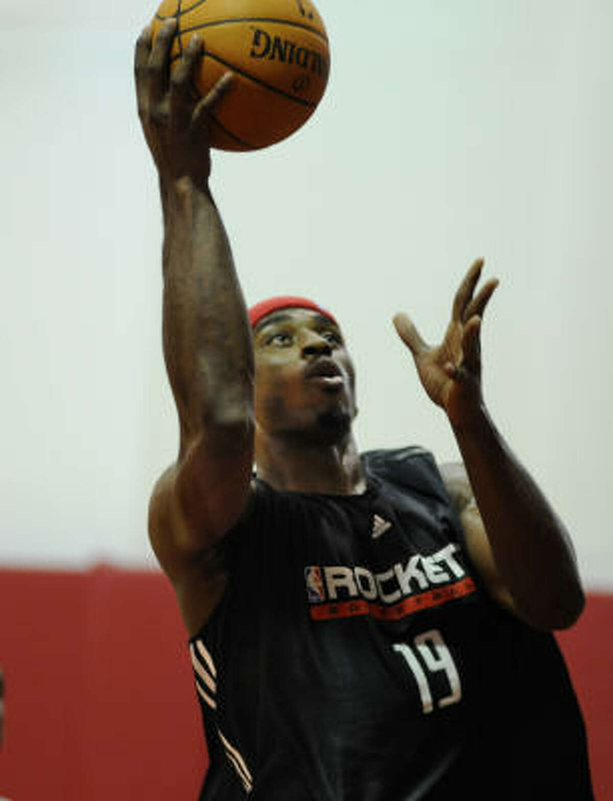 Mike Harris attempts a layup at during a Houston Rockets practice session.