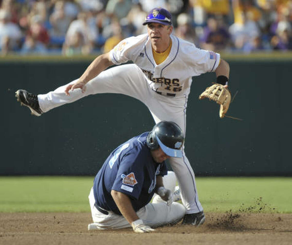 North Carolina second baseman Kyle Seager receives the ball from shortstop  Ryan Graepel (not shown) before turning a double play against LSU to end  the second inning of an NCAA College World