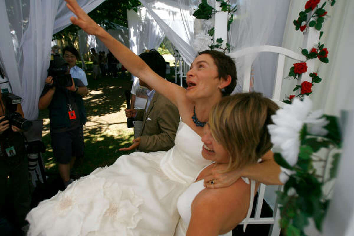 Tori (L) and Kate Kendall, who already share the same last name and have a five-month-old baby, celebrate after being joined in wedlock as the era of same-sex marriage begins in California, on Tuesday, June 17, in West Hollywood.