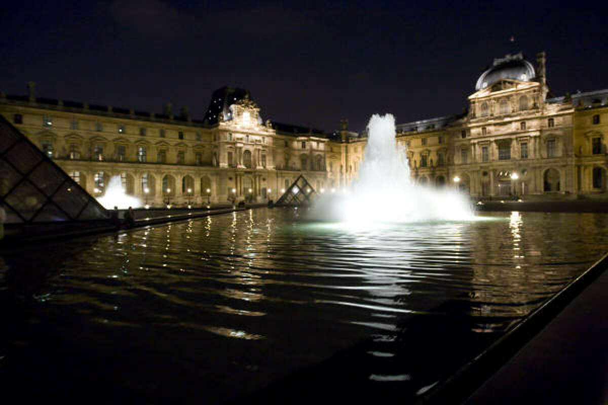 View of the Louvre museum in Paris. Never before has the art museum hosted such a grand charity soiree.