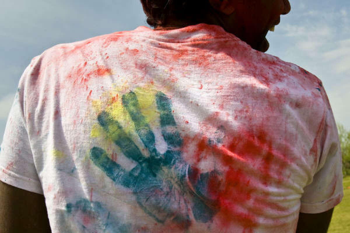 Hand prints from friends are seen on the back of Amit Sreedham's shirt.