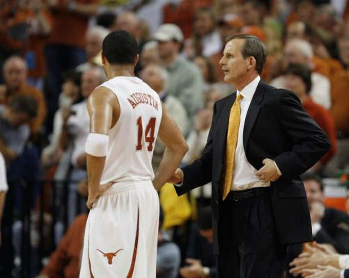 Texas coach Rick Barnes (right) talks with guard D.J. Augustin during the second half.
