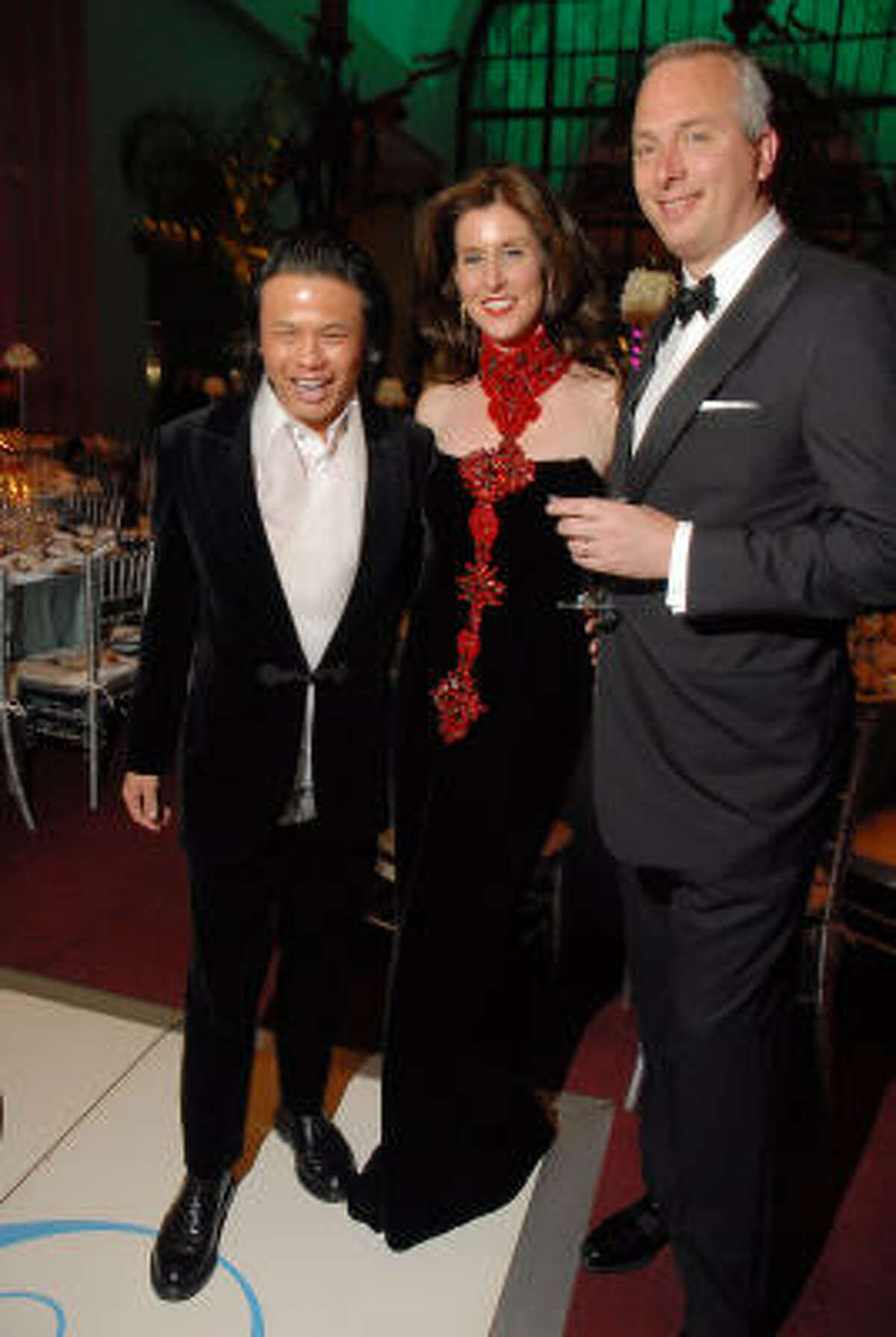 Designer Zang Toi, left, with Phoebe and Bobby Tudor