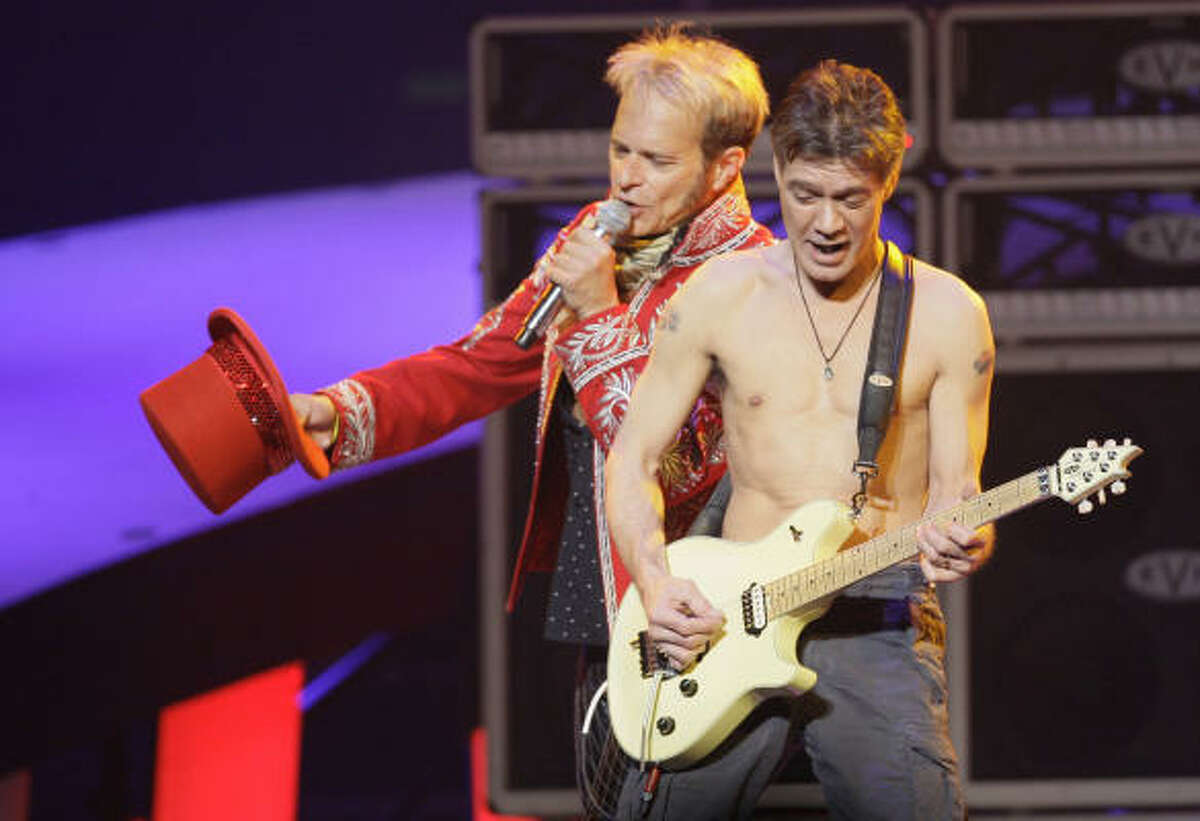 David Lee Roth, left, and Eddie Van Halen perform during the Van Halen reunion tour Monday, Jan. 28, at Houston's Toyota Center.