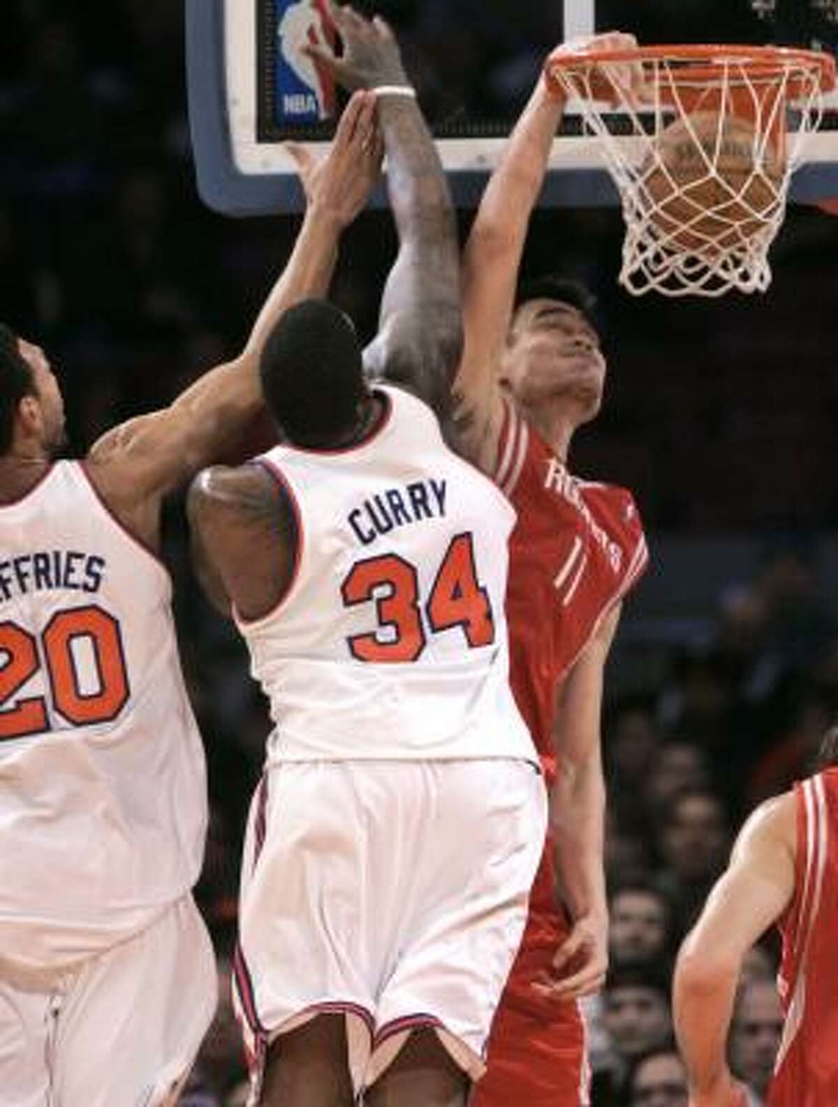 nate robinson dunking over yao ming