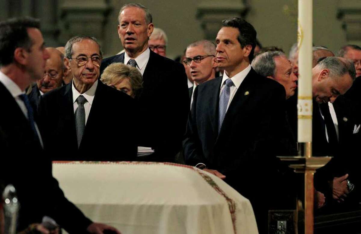 From left, former New York Gov. Mario Cuomo, George Pataki, Gov. Andrew Cuomo, New York City Mayor Michael Bloomberg, and Sen. Chuck Schumer stand near the casket of former Gov. Hugh Carey Thursday, Aug. 11, 2011 at St. Patrick's Cathedral in New York. The Brooklyn-born Carey served two terms as New York governor from 1975 to 1982 after seven terms as a congressman representing his home borough. Carey died Sunday, Aug. 7, 2011. He was 92. (AP Photo/Craig Ruttle)