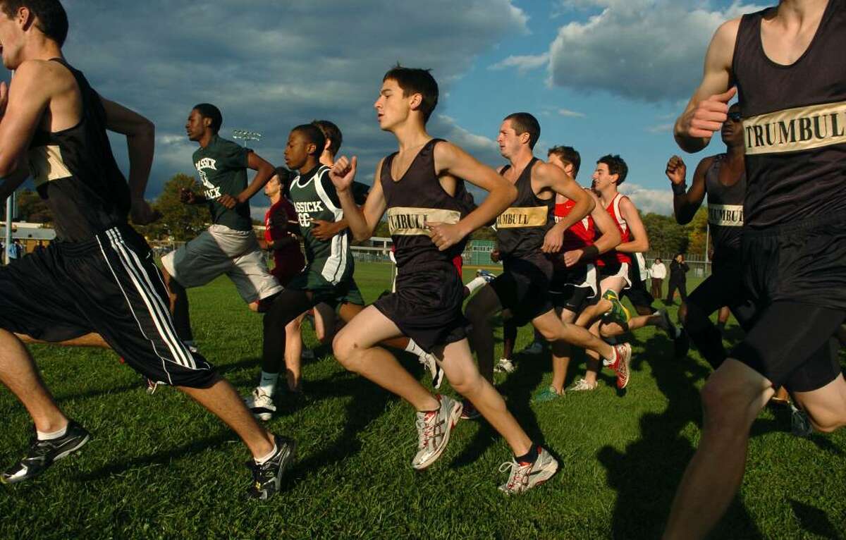 Trumbull's Jake Verone, center, passes by at the start of the boys cross country event at Trumbull High in Trumbull, Conn. on Tuesday Oct. 13, 2009.
