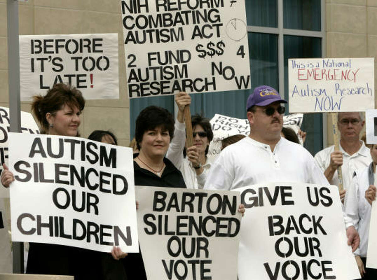 Demonstrators call for passage of the Combating Autism Act on Monday in Richardson. Some parents of autistic children are angry with Rep. Joe Barton, R-Ennis, chairman of the House Energy and Commerce Committee, because they say he is holding up the measure.