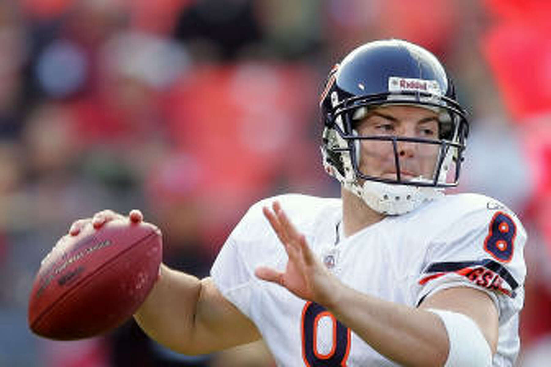 Chicago Bears quarterback Rex Grossman sets to pass during his