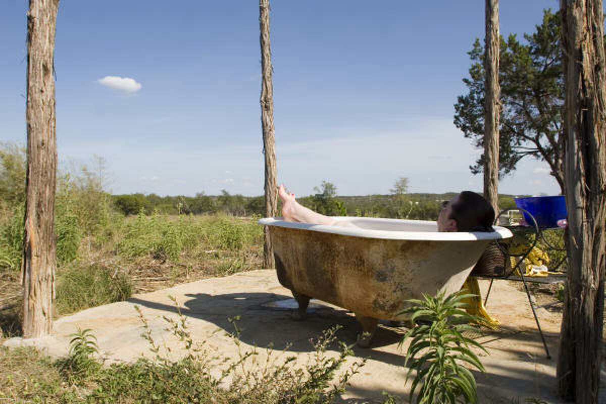Tina Moody of Dripping Springs not only has cut back on her water use, but takes baths in an old clawfoot tub outside her home and uses the water for irrigation. "We just live in such denial as a culture about the limitations of our resources," she said.