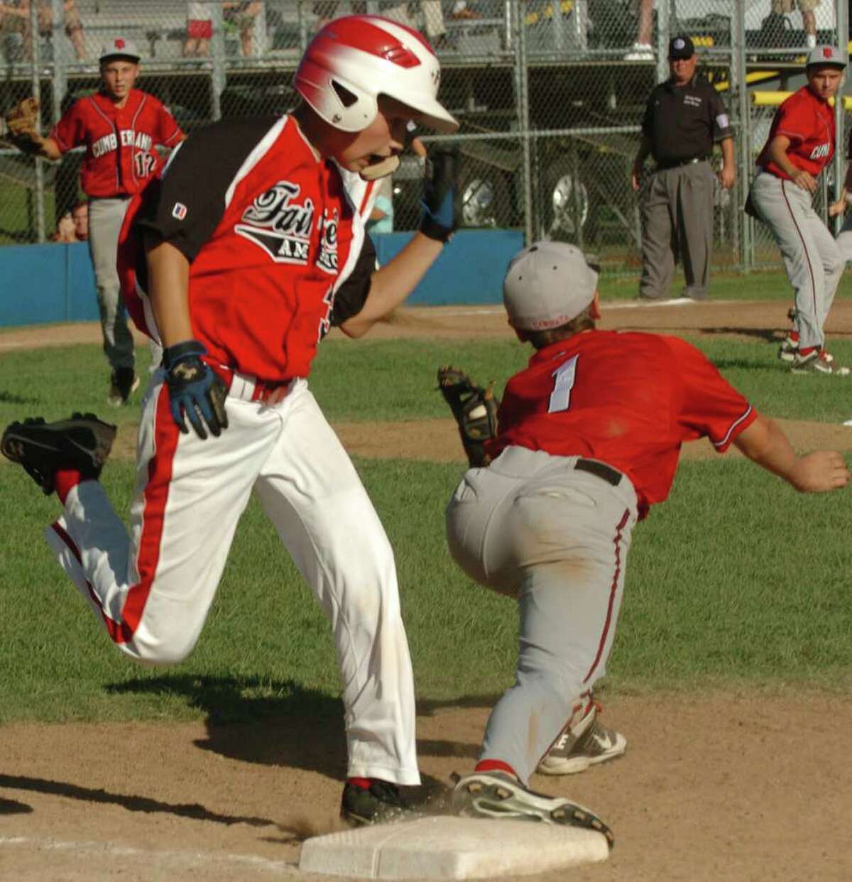 Fairfield American's #3 Phillip Vlandis is tagged out at first by Rhode Island's #1 Colin Cannata, ending the game, at the Little League Baseball Eastern Regional Semi-fiinal game in Bristol, Conn. on Thursday August 11, 2011. Fairfield American was beat 8-7.