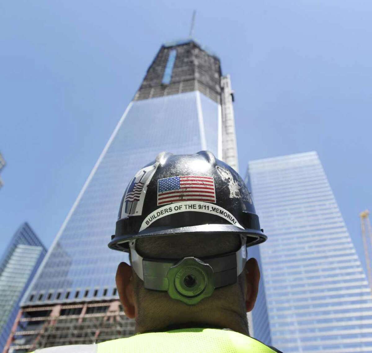 Chris Powers of KC Fabrications, Inc., of Gardiner, N.Y., the company constructing the memorials at the Freedom Tower, looks skyward toward the tower in New York City, Thursday, Aug. 11, 2011, that is under construction a month before the 10th anniversary of 9/11. Bob Lucky/Hearst Newpapers