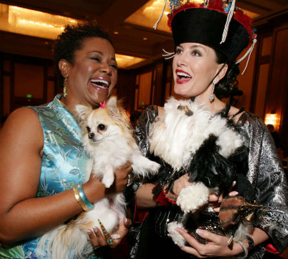 Debra Duncan, left, and Kimberly DeLape chaired the Citizens for Animal Protection 15th annual Mr. Magoo birthday party at the J.W. Marriott.