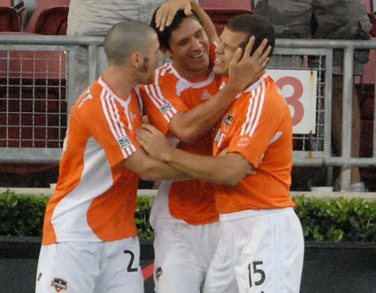 Teammates like the Dynamo's Brian Ching (center), and so do All-Star voters.
