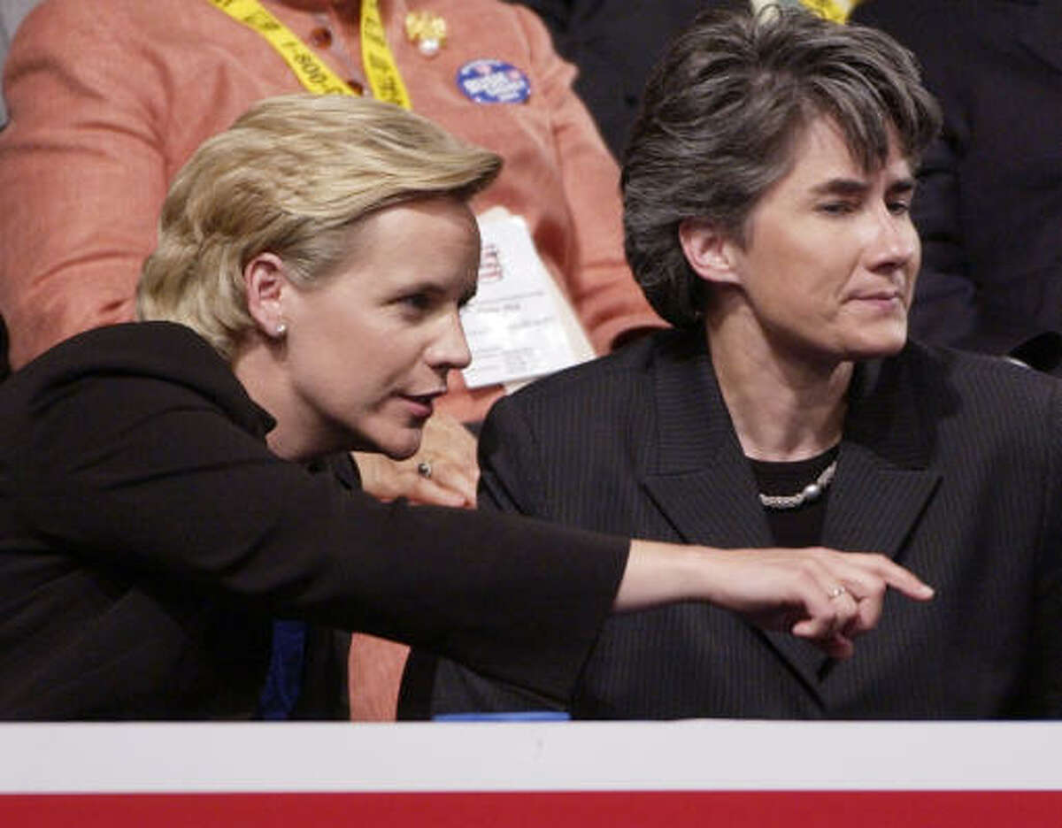 Mary Cheney, left, sits with her partner, Heather Poe, during the 2004 GOP convention. They are expecting a baby in late spring.
