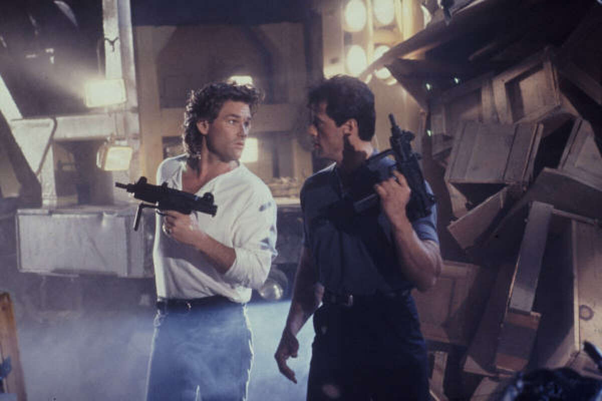 TANGO & CASH (1989): Kurt Russell and Sylvester Stallone are rival cops forced to work together.