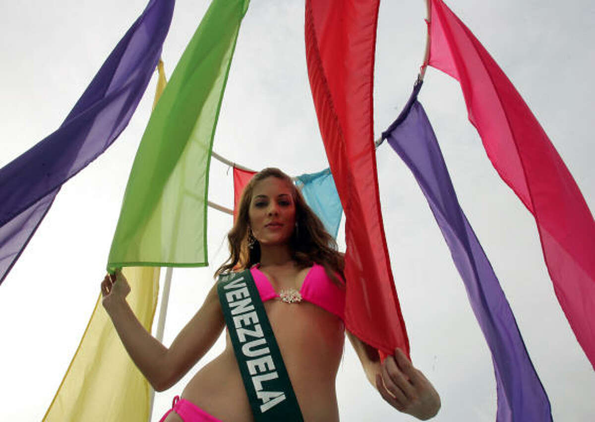 Silvana Santaella Arellano, a candidate from Venezuela for the 2007 Miss Earth beauty pageant, poses by the pool at the Golden Sunset Resort at Calatagan, Batangas province, south of Manila, Philippines, on Saturday.