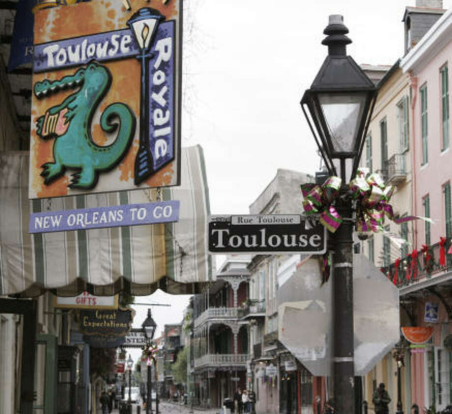 It S Still A Big Easy Feast Laredo Morning Times Decorated Street Lamps And French Quarter Banners Greet Tourists In Post Katrina New Orleans