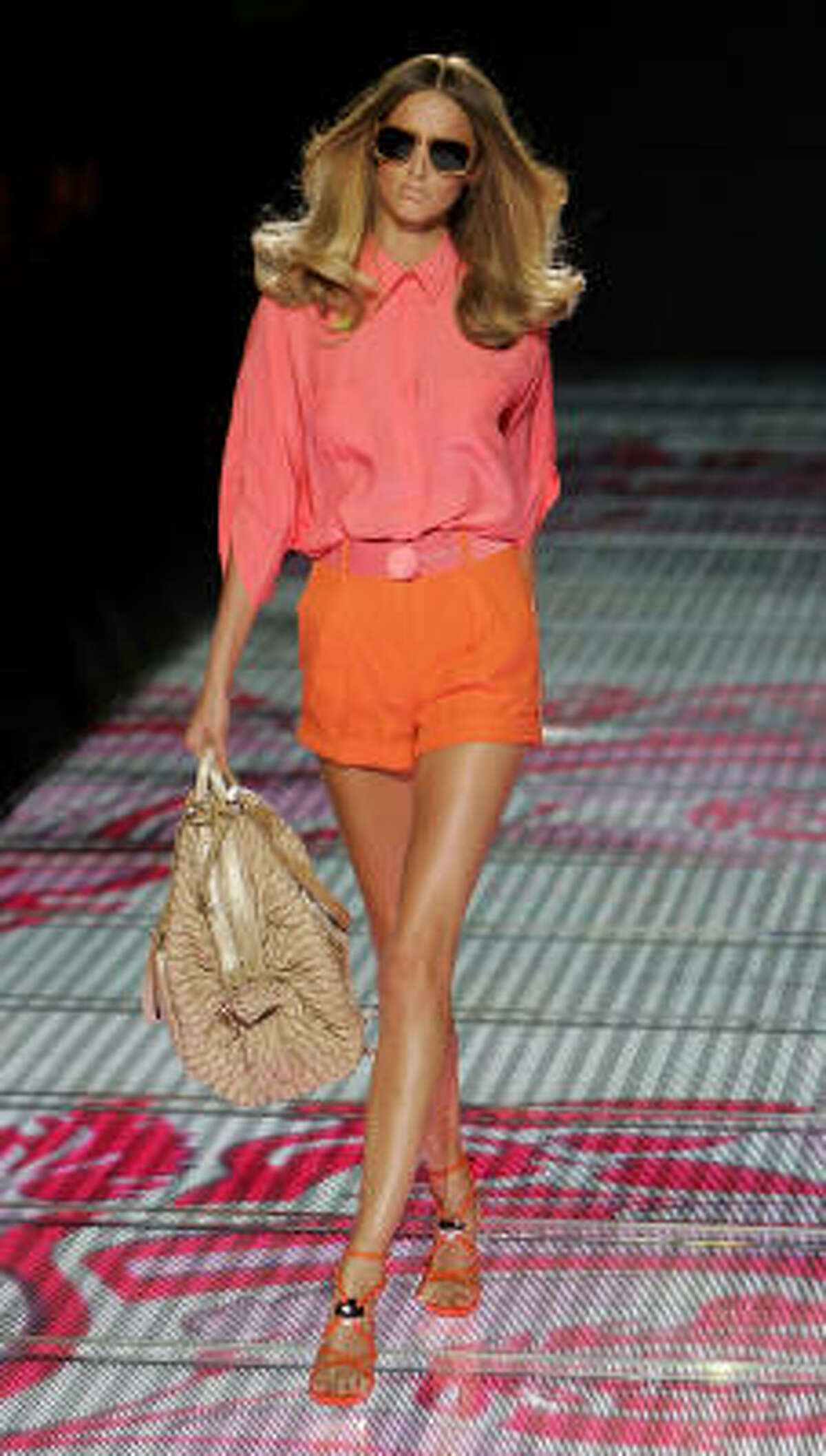 A model wears an outfit part of Gianni Versace Spring-Summer 2007