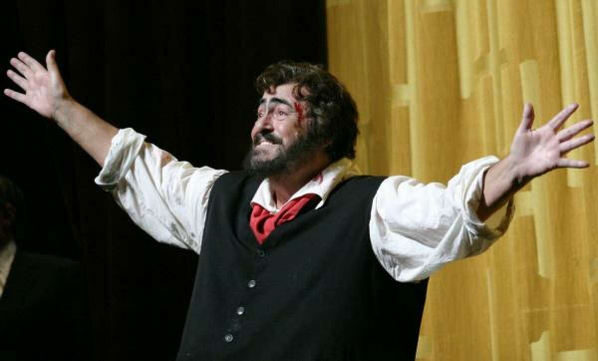 March 2004: Luciano Pavarotti answers a curtain call of Puccini's Tosca" at the Metropolitan Opera in New York.